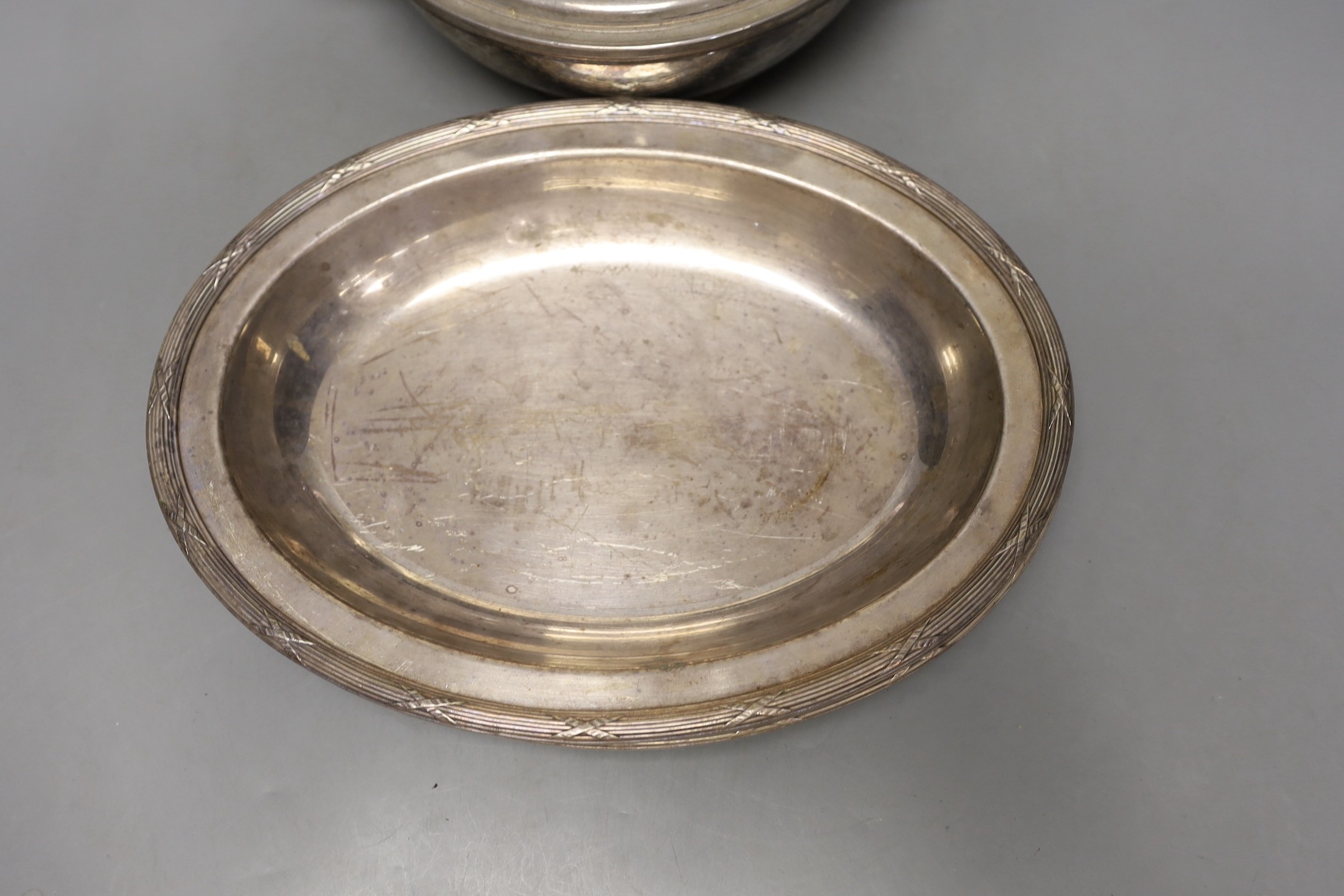 A set of four Christofle plated serving dishes, a similar ecuelle and cover and an Egyptian plated dish.